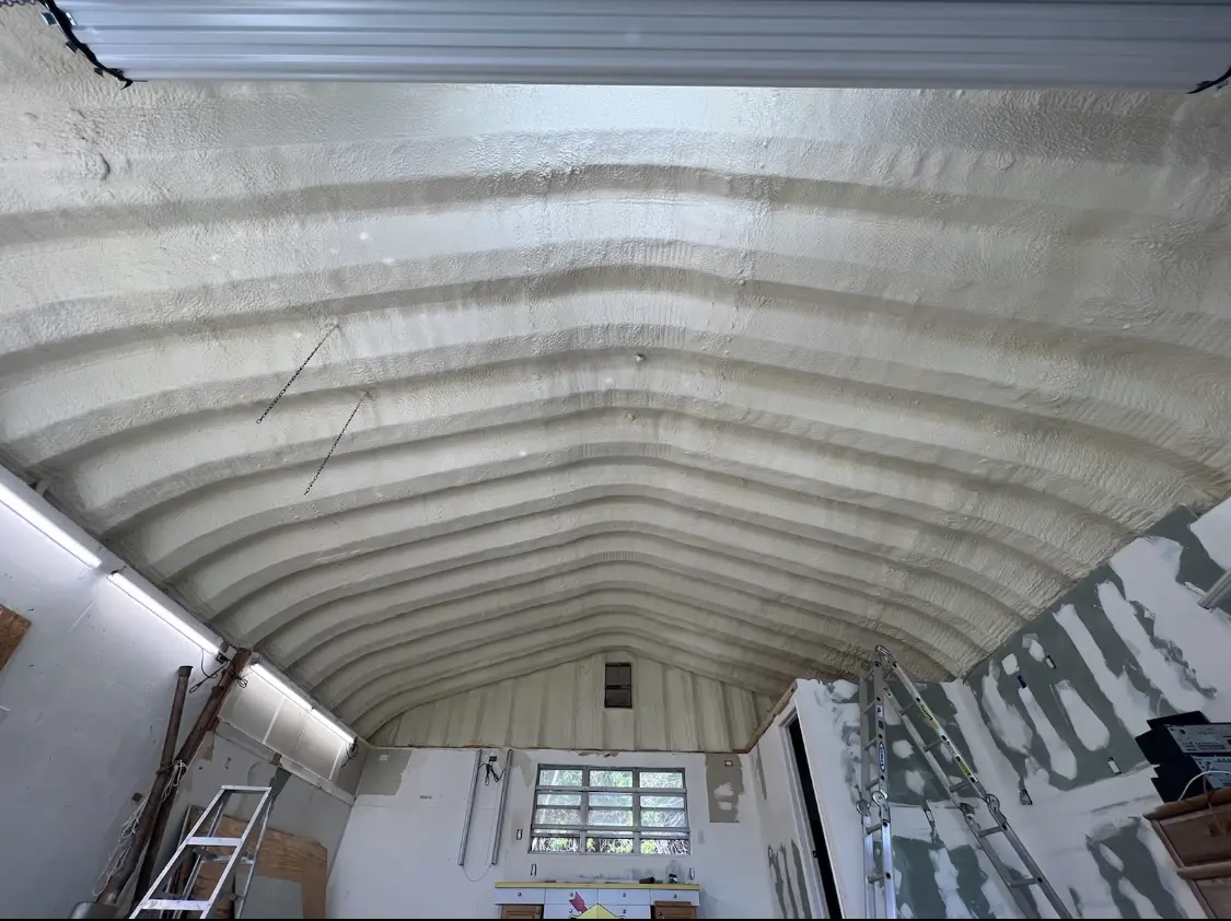 Spray polyurethane foam applied to the underside of a metal roof deck in Wauseon